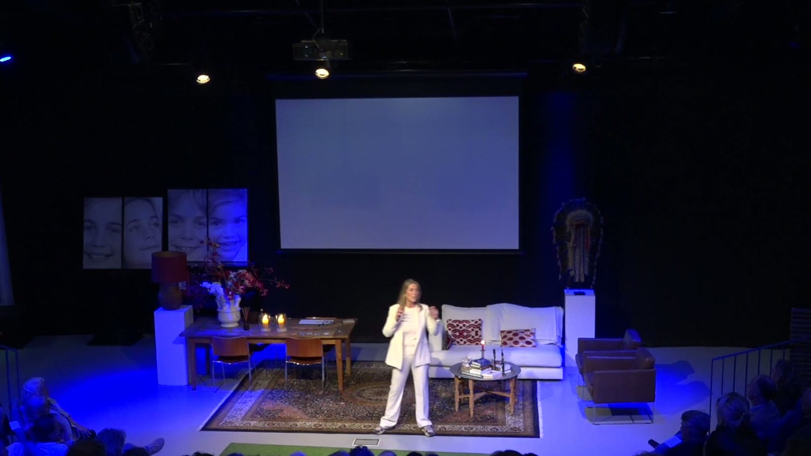 Dymphe Beek speaking on a theater stage